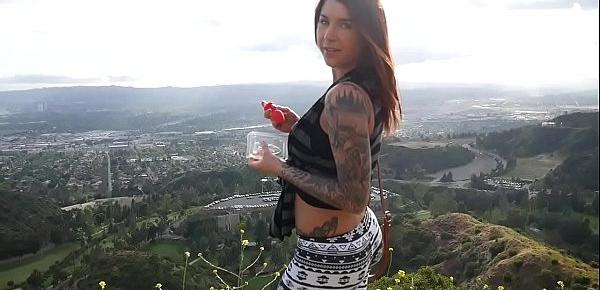  Felicity Feline plays with her ass with a buttplug outdoors in Los Angeles